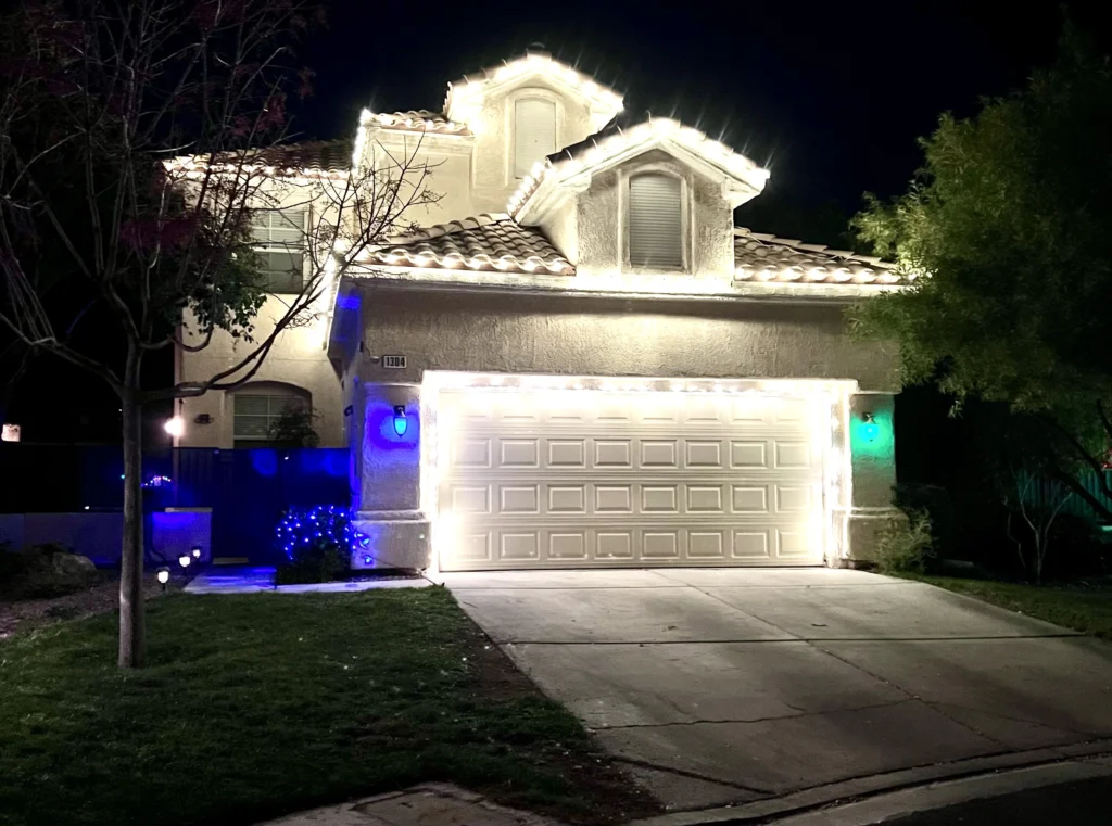 White Christmas lights installed on a Summerlin home